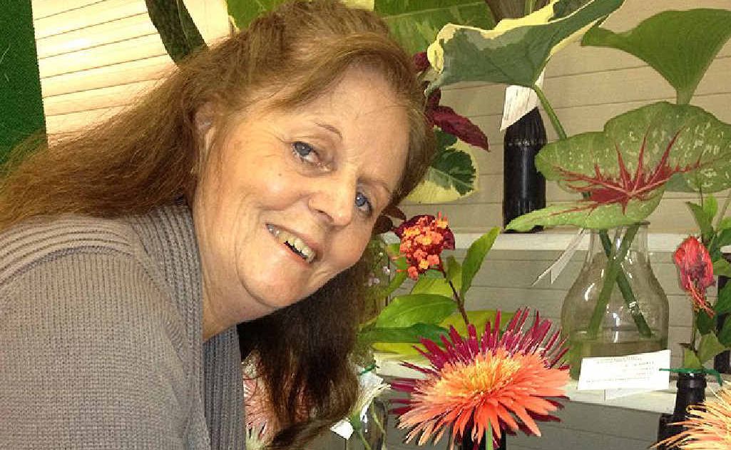 BLOOMIN BEAUTY: Colleen Houghton with her Gympie Show Grand Champion Gerbera. BLOOMIN BEAUTY: Colleen Houghton with her Gympie Show Grand Champion Gerbera.